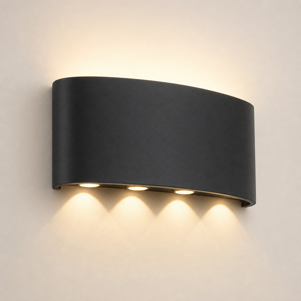 Restaurant wall sconce with sculptural up and down light