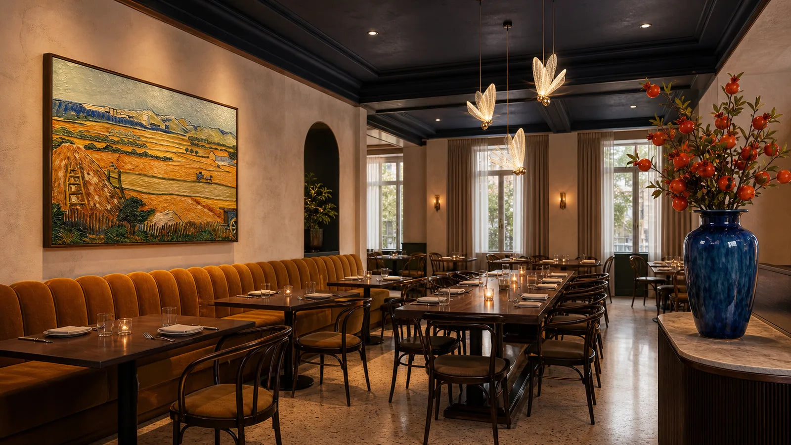 A warm dining salon in deep saffron and ochre tones with layered pendant and wall light